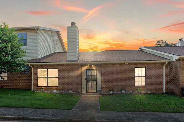 259 Mayflower Ln N, Madison, TN 37115 - view of front of property with a chimney, a front yard, and brick siding