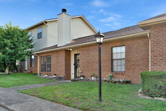 259 Mayflower Ln N, Madison, TN 37115 - view of front of property with brick siding, a front yard, and a chimney