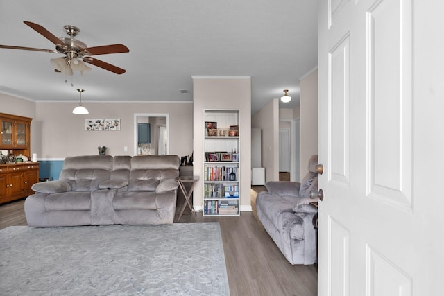 259 Mayflower Ln N, Madison, TN 37115 - living area featuring wood finished floors, a ceiling fan, and ornamental molding