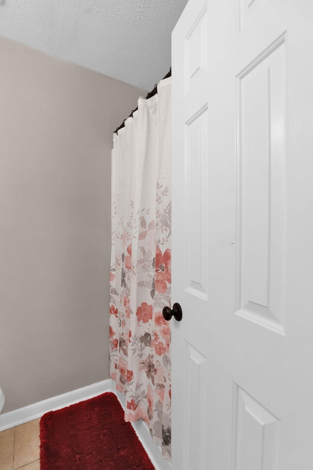 259 Mayflower Ln N, Madison, TN 37115 - full bath with a textured ceiling, tile patterned flooring, and curtained shower