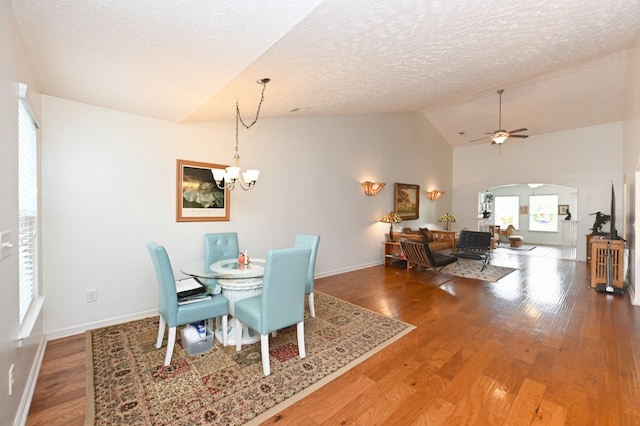 395 Devon Chase Hl Unit 3602, Gallatin, TN 37066 - dining area with lofted ceiling, arched walkways, a chandelier, wood finished floors, and a textured ceiling