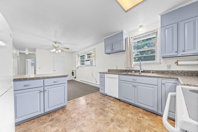 3892 Cedar St, Centerville, TN 37033 - kitchen with white dishwasher, range, ceiling fan, dark countertops, and light carpet