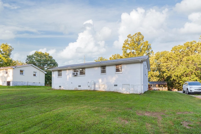 3892 Cedar St, Centerville, TN 37033 - rear view of house featuring crawl space, a yard, and a metal roof