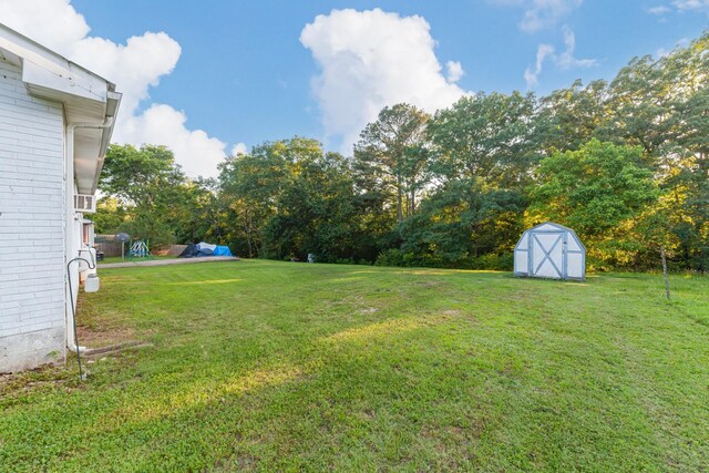 3892 Cedar St, Centerville, TN 37033 - view of green lawn with a storage shed