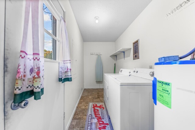 3892 Cedar St, Centerville, TN 37033 - washroom with water heater, washing machine and clothes dryer, and stone finish floors
