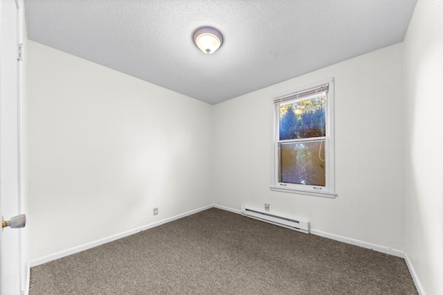 3892 Cedar St, Centerville, TN 37033 - unfurnished room with a baseboard heating unit, dark carpet, and a textured ceiling