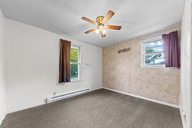 3892 Cedar St, Centerville, TN 37033 - spare room featuring a baseboard heating unit, carpet floors, ceiling fan, and healthy amount of natural light