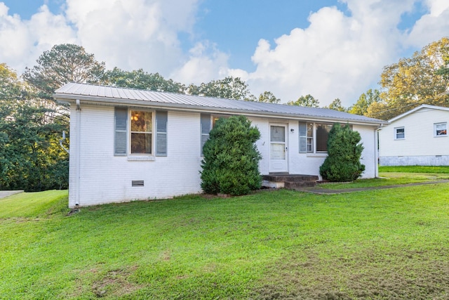 3892 Cedar St, Centerville, TN 37033 - view of front facade featuring brick siding, crawl space, and a front lawn