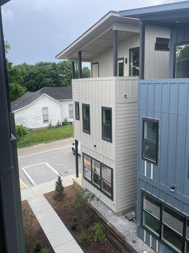 1206 1st Ave Unit 4, Nashville, TN 37210 - view of side of home with board and batten siding and a balcony
