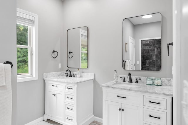 1250 Ed Seay Gregory Ln, Hartsville, TN 37074 - bathroom with two vanities and baseboards