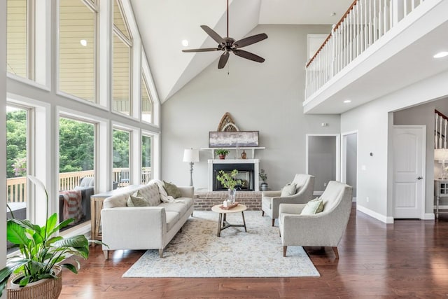 1250 Ed Seay Gregory Ln, Hartsville, TN 37074 - living room with high vaulted ceiling, ceiling fan, wood finished floors, and a fireplace