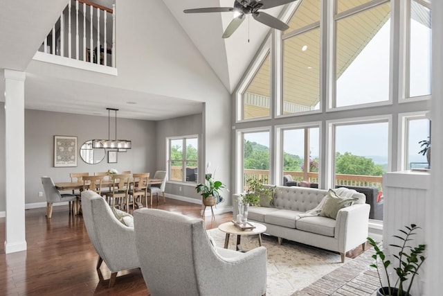 1250 Ed Seay Gregory Ln, Hartsville, TN 37074 - living area with ornate columns, high vaulted ceiling, a ceiling fan, wood finished floors, and a chandelier
