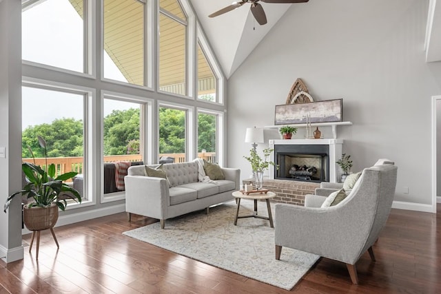 1250 Ed Seay Gregory Ln, Hartsville, TN 37074 - living area featuring high vaulted ceiling, ceiling fan, a fireplace, and dark wood-style floors