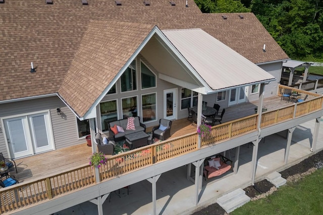 1250 Ed Seay Gregory Ln, Hartsville, TN 37074 - rear view of house with a wooden deck, a shingled roof, outdoor lounge area, and outdoor dining space