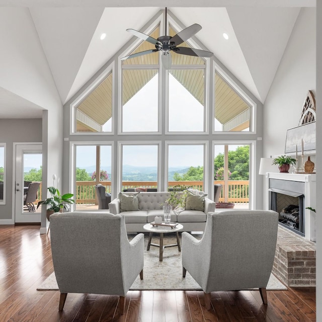 1250 Ed Seay Gregory Ln, Hartsville, TN 37074 - living room featuring a fireplace, a ceiling fan, hardwood / wood-style flooring, and high vaulted ceiling