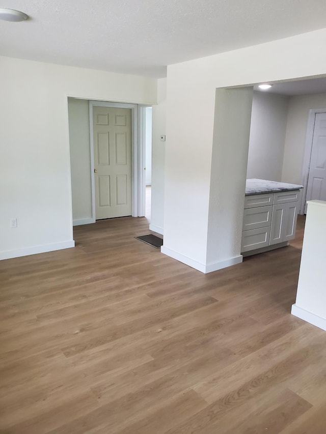 1171 5th St, Jellico, TN 37762 - spare room with baseboards and light wood-style flooring