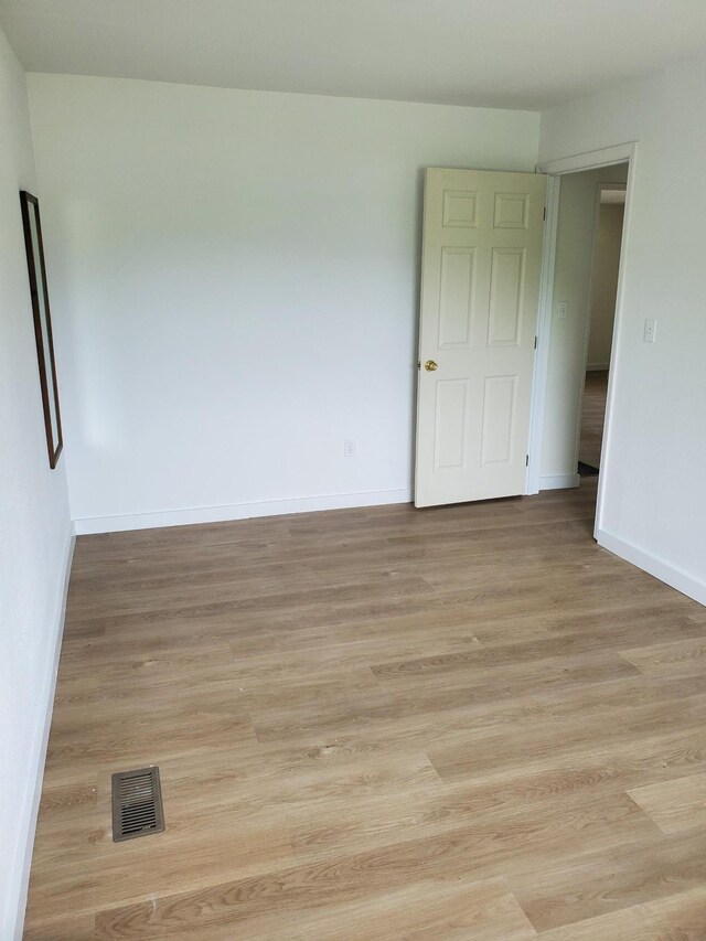 1171 5th St, Jellico, TN 37762 - empty room featuring baseboards and light wood-style floors