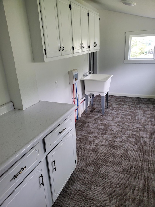1171 5th St, Jellico, TN 37762 - laundry room featuring washer hookup, cabinet space, and dark carpet