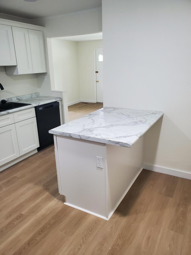 1171 5th St, Jellico, TN 37762 - kitchen with dishwasher, white cabinets, light wood finished floors, and light stone counters
