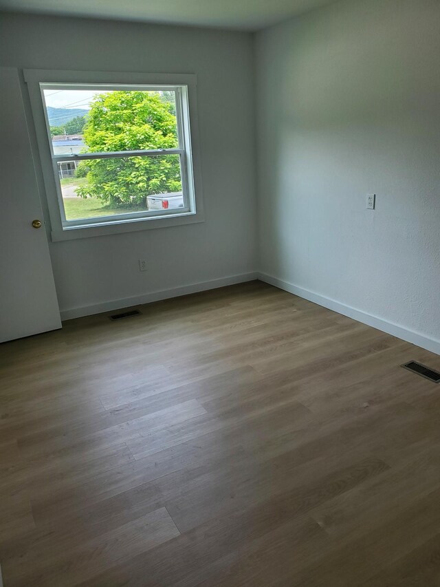 1171 5th St, Jellico, TN 37762 - empty room with baseboards and wood finished floors