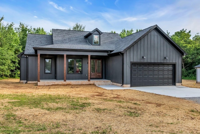 4106 Asbury Rd, Manchester, TN 37355 - modern farmhouse featuring board and batten siding, a shingled roof, driveway, and an attached garage