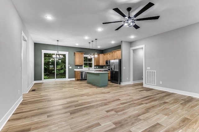 4106 Asbury Rd, Manchester, TN 37355 - kitchen featuring stainless steel appliances, open floor plan, light countertops, light wood-style floors, and recessed lighting