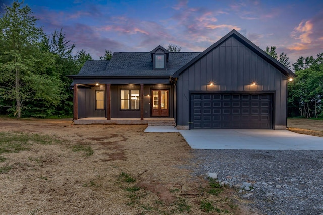 4106 Asbury Rd, Manchester, TN 37355 - modern inspired farmhouse featuring concrete driveway, a garage, a shingled roof, french doors, and board and batten siding