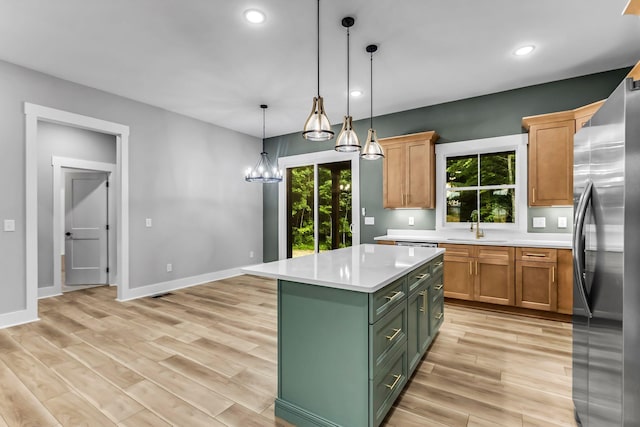 4106 Asbury Rd, Manchester, TN 37355 - kitchen featuring freestanding refrigerator, light countertops, green cabinetry, recessed lighting, and light wood-type flooring