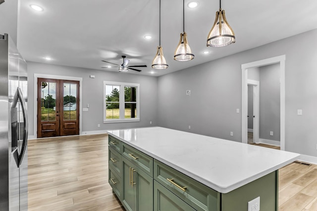 4106 Asbury Rd, Manchester, TN 37355 - kitchen with green cabinetry, recessed lighting, light wood finished floors, ceiling fan, and light countertops