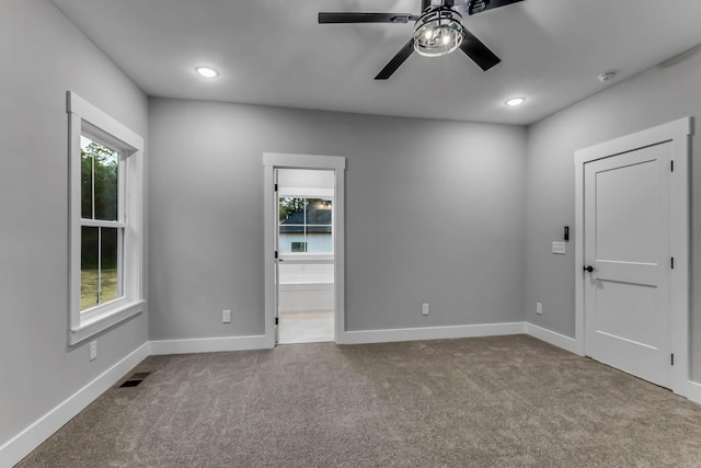 4106 Asbury Rd, Manchester, TN 37355 - unfurnished room featuring healthy amount of natural light, ceiling fan, carpet, recessed lighting, and a smoke detector