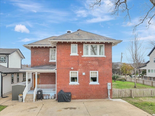 709 S Greenwood Ave S, Chattanooga, TN 37404 - rear view of property featuring brick siding and a porch