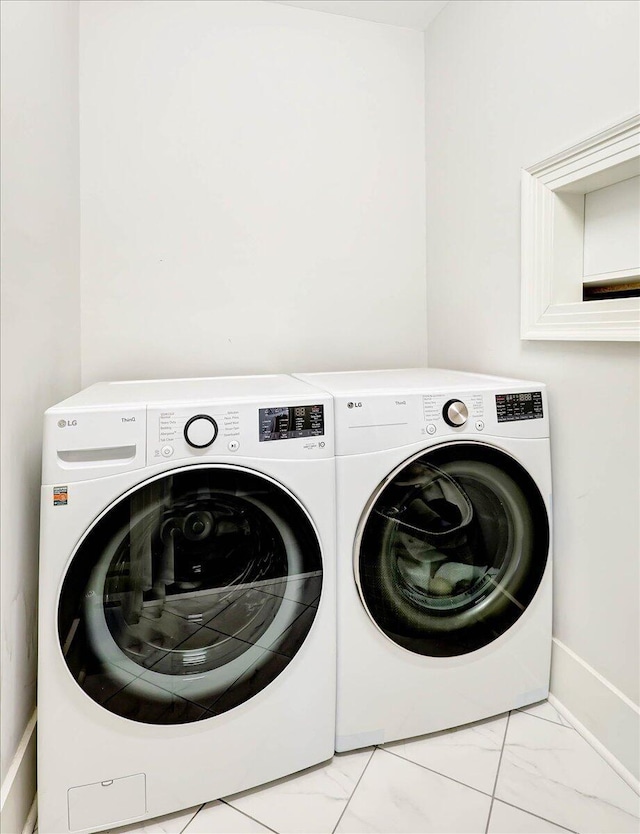 709 S Greenwood Ave S, Chattanooga, TN 37404 - washroom with separate washer and dryer and marble look tile flooring