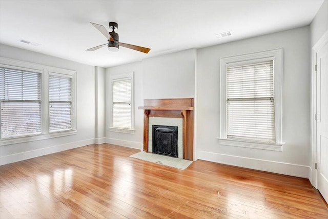 709 S Greenwood Ave S, Chattanooga, TN 37404 - unfurnished living room with ceiling fan, wood finished floors, and a fireplace with flush hearth