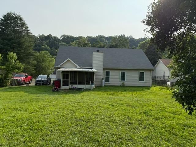 3367 Clearwater Dr, Clarksville, TN 37042 - rear view of property featuring a sunroom and a lawn