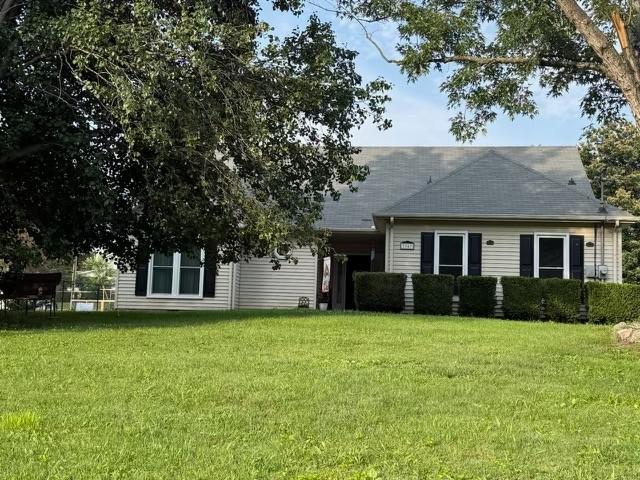 3367 Clearwater Dr, Clarksville, TN 37042 - view of front of home with a front yard and roof with shingles