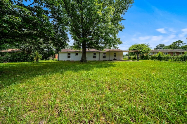 205 Walnut St, Smyrna, TN 37167 - view of green lawn featuring a carport