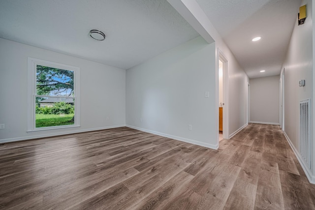 205 Walnut St, Smyrna, TN 37167 - spare room featuring wood finished floors and recessed lighting