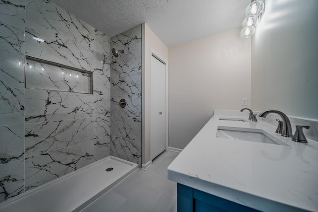 205 Walnut St, Smyrna, TN 37167 - bathroom featuring a marble finish shower, double vanity, and a textured ceiling