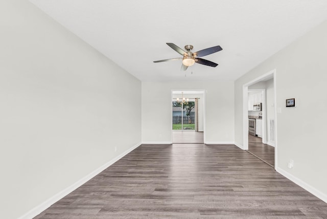 3405 Polly Dr, Clarksville, TN 37042 - spare room featuring a chandelier, ceiling fan, and dark wood-style flooring