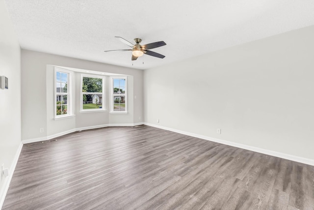 3405 Polly Dr, Clarksville, TN 37042 - empty room with ceiling fan and dark wood-type flooring