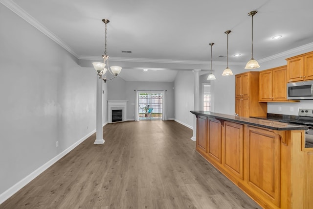 2342 N Tennessee Blvd Unit 603, Murfreesboro, TN 37130 - kitchen with appliances with stainless steel finishes, wood finished floors, a kitchen bar, ornamental molding, and decorative light fixtures