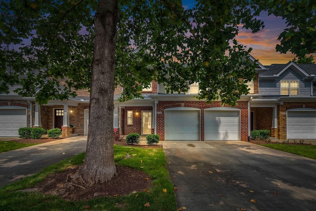 2342 N Tennessee Blvd Unit 603, Murfreesboro, TN 37130 - view of front of property featuring driveway, a garage, and brick siding