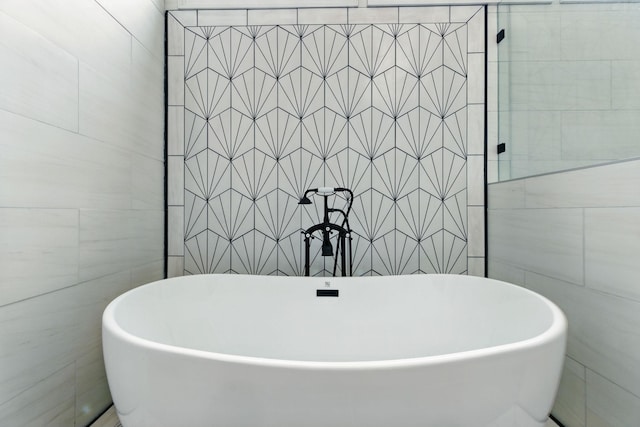 1060 Wilshire Way, Brentwood, TN 37027 - bathroom featuring tile walls and a freestanding bath