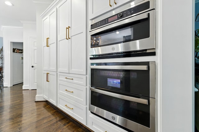 1060 Wilshire Way, Brentwood, TN 37027 - kitchen featuring double oven, dark wood-style floors, white cabinetry, crown molding, and recessed lighting