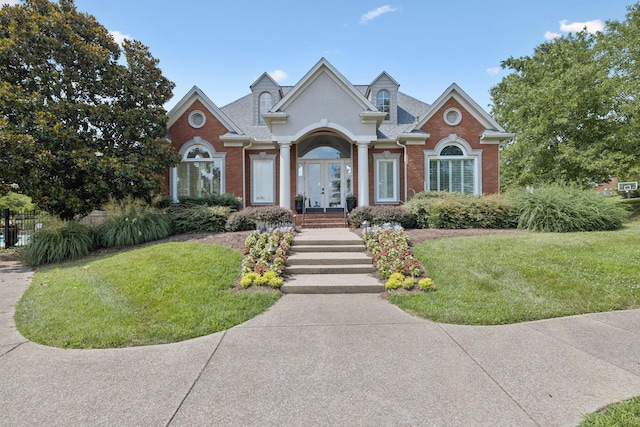 1060 Wilshire Way, Brentwood, TN 37027 - view of front of house with french doors, brick siding, and a front lawn
