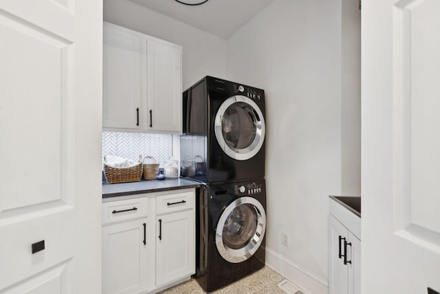 1060 Wilshire Way, Brentwood, TN 37027 - laundry area with stacked washer and clothes dryer and cabinet space