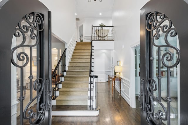 1060 Wilshire Way, Brentwood, TN 37027 - foyer entrance featuring a high ceiling, a decorative wall, wainscoting, stairway, and wood finished floors