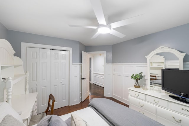1060 Wilshire Way, Brentwood, TN 37027 - bedroom with a wainscoted wall, a closet, dark wood-style floors, a decorative wall, and a ceiling fan