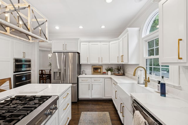 1060 Wilshire Way, Brentwood, TN 37027 - kitchen featuring stainless steel appliances, white cabinets, ornamental molding, backsplash, and dark wood finished floors