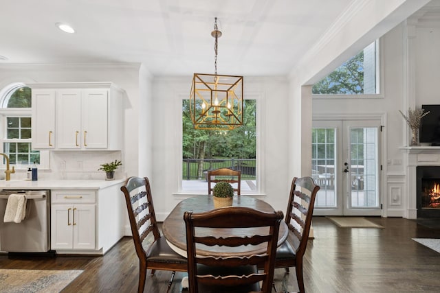 1060 Wilshire Way, Brentwood, TN 37027 - dining room featuring a chandelier, a fireplace with flush hearth, crown molding, french doors, and dark wood-style floors